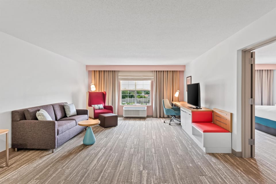 Studio Suite, 1 King Bed with Sofa Bed | Living area | 32-inch LCD TV with cable channels, TV