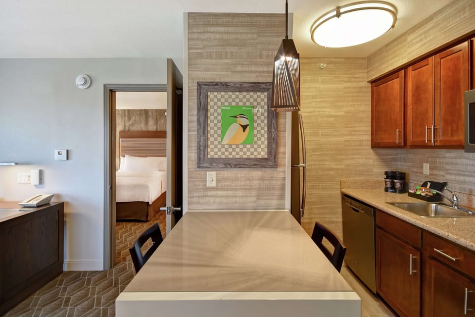 Suite, 2 Queen Beds | Private kitchen | Coffee/tea maker, full-size fridge, microwave, stovetop