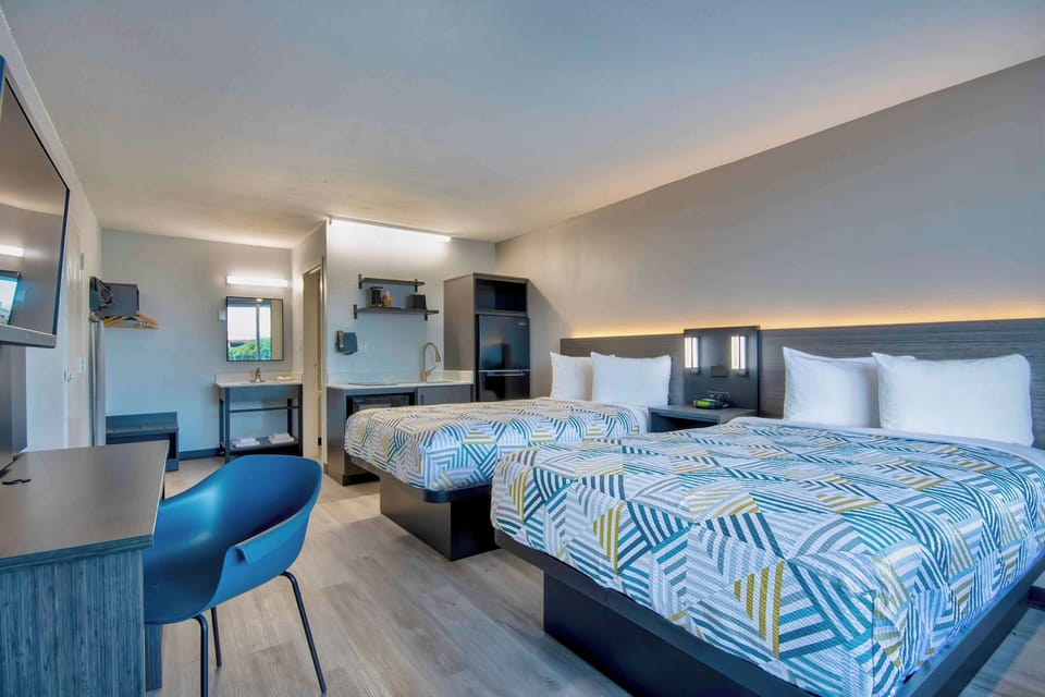 Desk, laptop workspace, blackout drapes, iron/ironing board