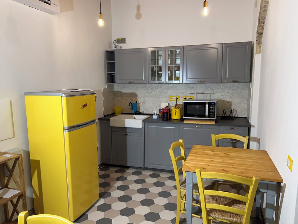 Espresso maker, coffee/tea maker, shared fridge, shared microwave