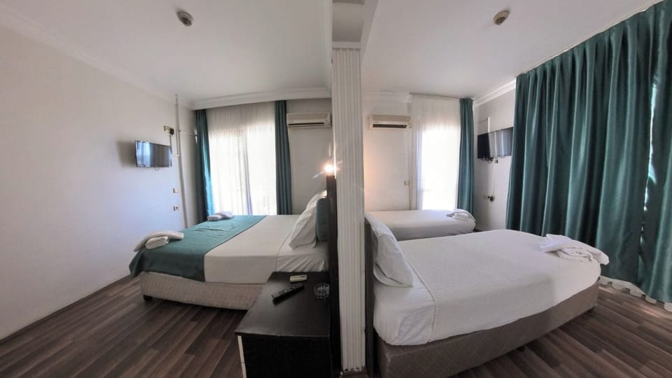 Family Quadruple Room, 2 Bedrooms, Smoking, Sea View | Premium bedding, free WiFi