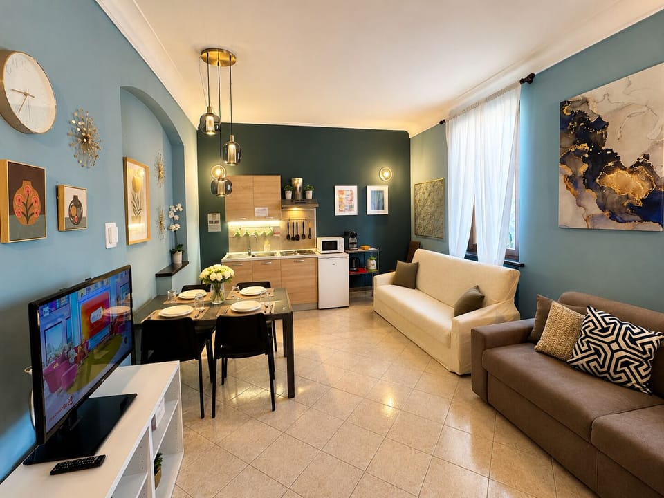 Deluxe Apartment, 1 Bedroom, Kitchenette | Living area | Flat-screen TV