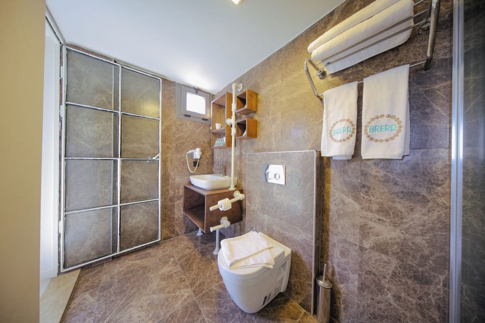 Economy Loft Room  | Bathroom | Shower, hair dryer, bathrobes, slippers