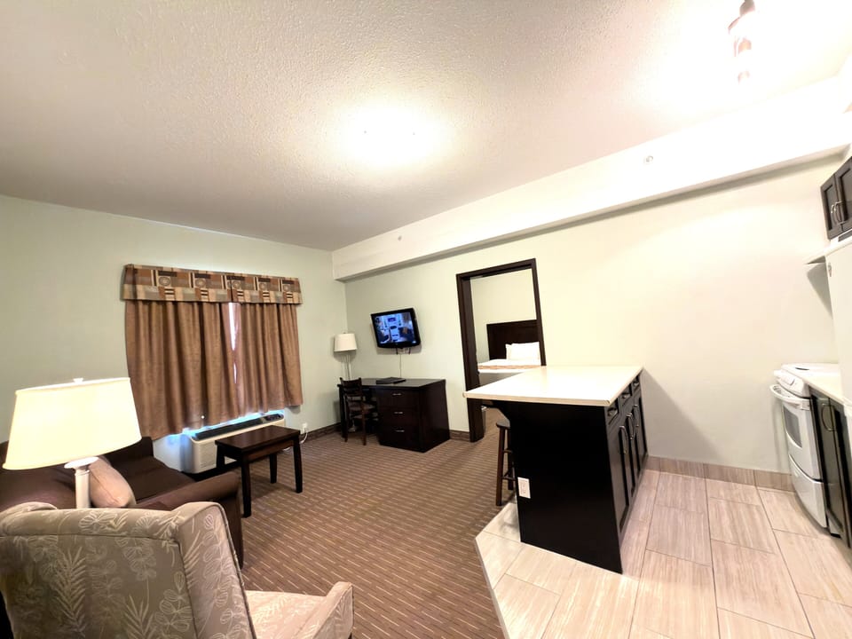 Executive Suite, 2 Bedrooms, Non Smoking | Desk, laptop workspace, iron/ironing board, WiFi (free)