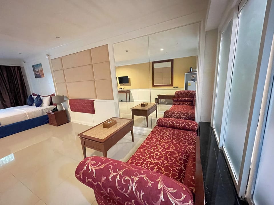 Grand Double Room | Living area | 32-inch TV with cable channels