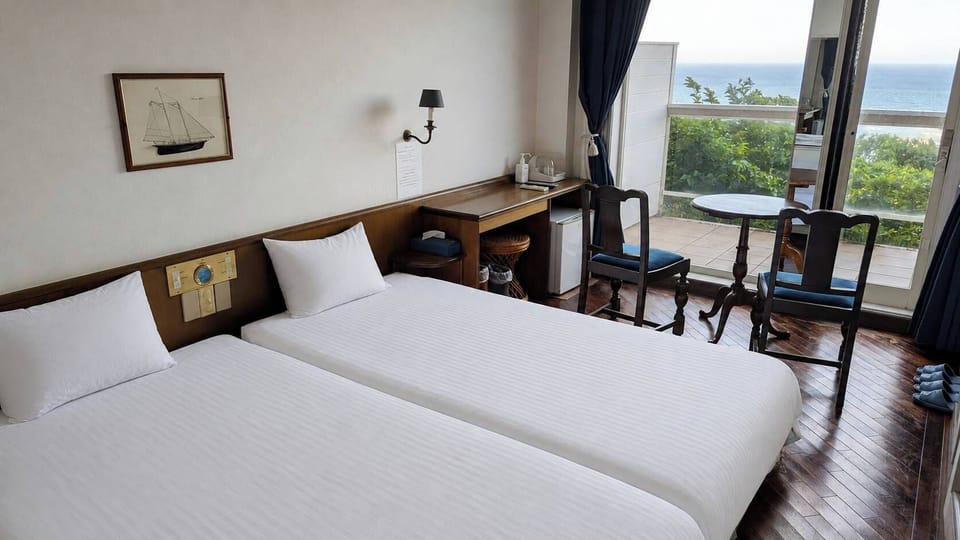 Deluxe Twin Room, Sea View | Laptop workspace, WiFi (free), bed sheets