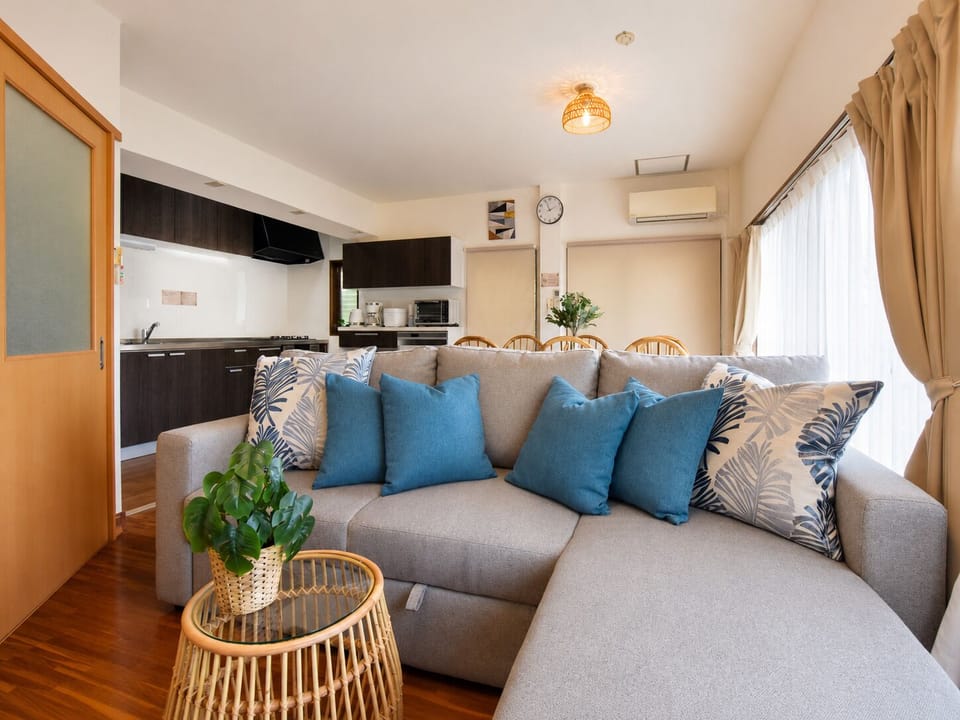 Family Villa, Balcony, Partial Ocean View | Living area | 55-inch flat-screen TV with cable channels