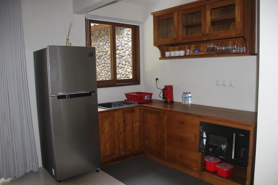 Family Room, Garden View | Private kitchen | Coffee/tea maker