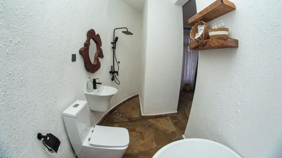 Separate tub and shower, free toiletries, hair dryer, slippers