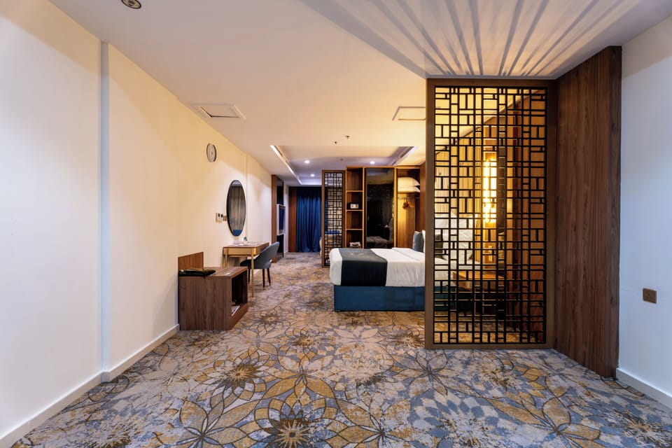 Luxury Suite, City View | In-room safe, desk, laptop workspace, blackout drapes