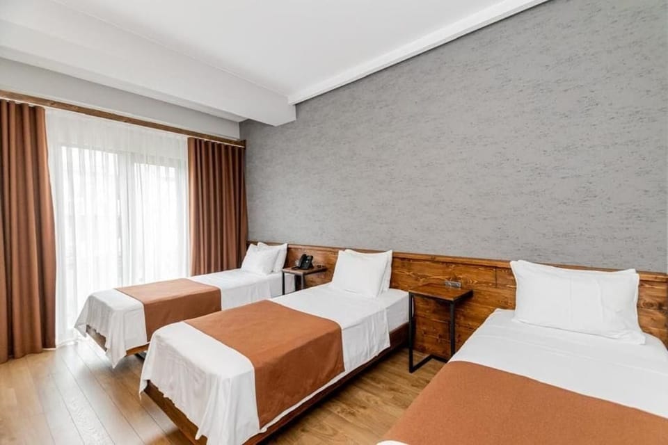 Deluxe Studio | In-room safe, desk, laptop workspace, blackout drapes