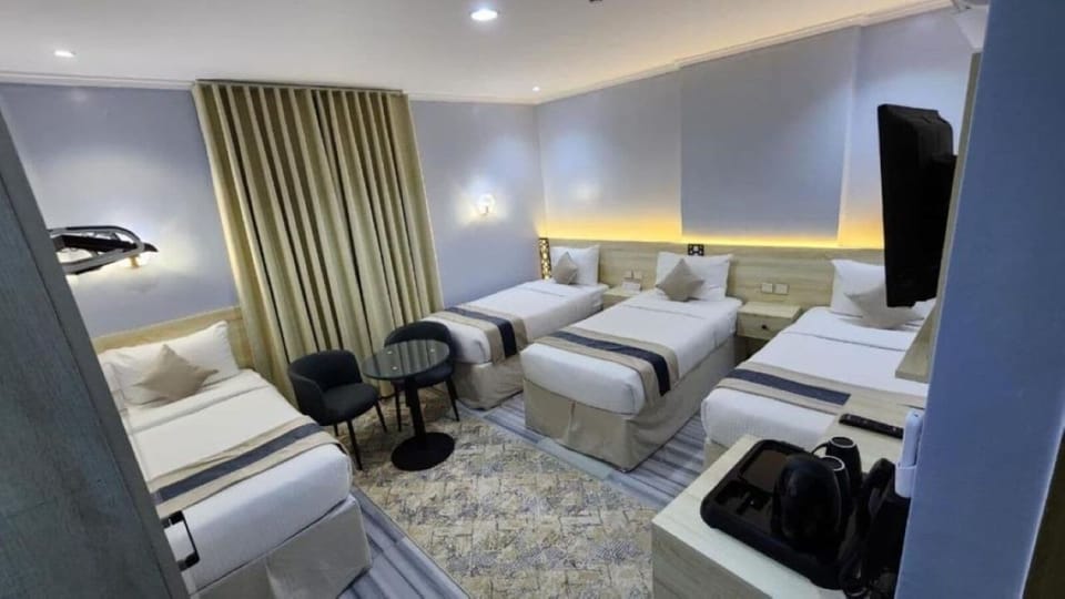 Deluxe Quadruple Room | Premium bedding, minibar, laptop workspace, WiFi (free)