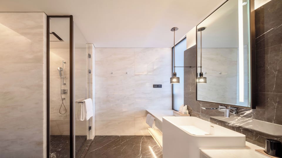 Shower, free toiletries, hair dryer, slippers