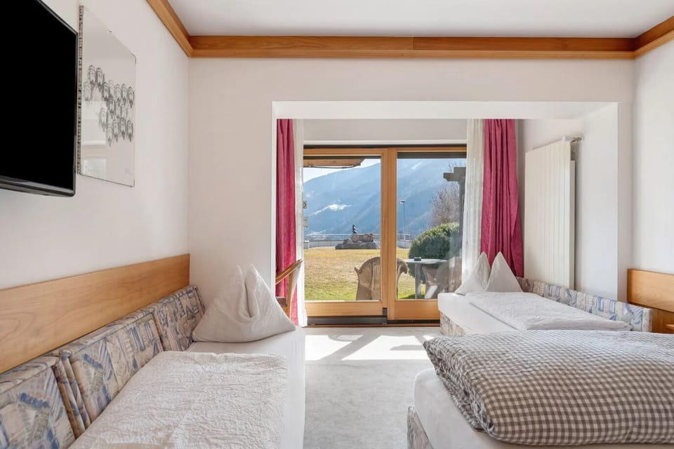 Classic Quadruple Room, City View | In-room safe, desk, laptop workspace, blackout drapes