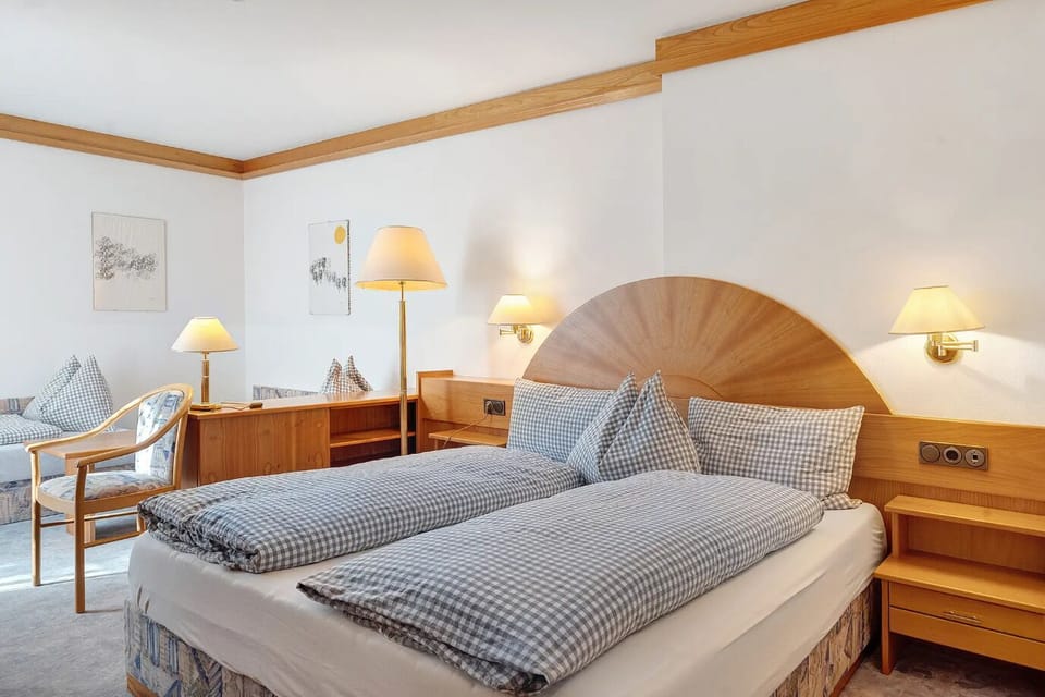 Classic Quadruple Room, City View | In-room safe, desk, laptop workspace, blackout drapes