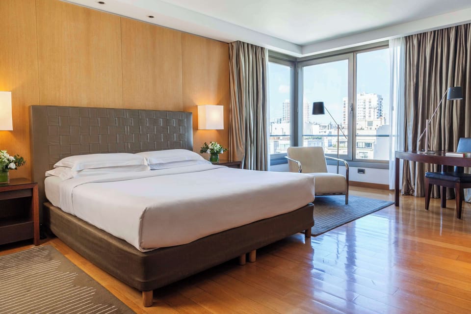 Premium bedding, down comforters, minibar, in-room safe