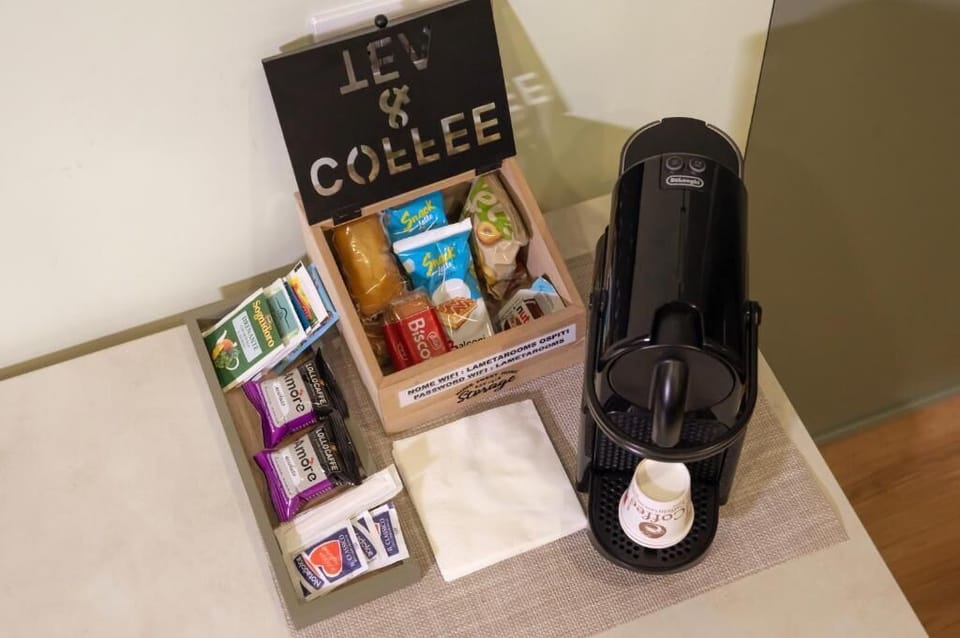 Deluxe Double Room, Courtyard View | Coffee and/or coffee maker