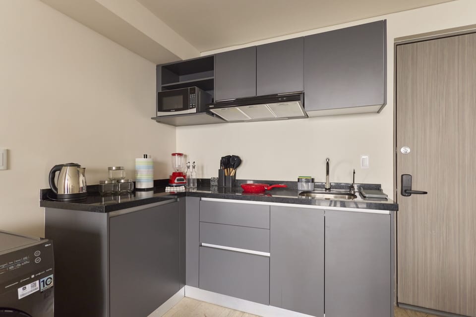 Comfort Apartment, City View | Private kitchen | Fridge, microwave, stovetop, cookware/dishes/utensils