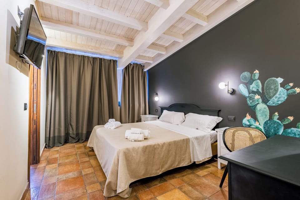 Standard Double Room | Minibar, in-room safe, blackout drapes, iron/ironing board (on request)
