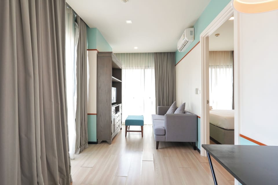 One Bedroom | Living area | 32-inch LCD TV with cable channels, TV