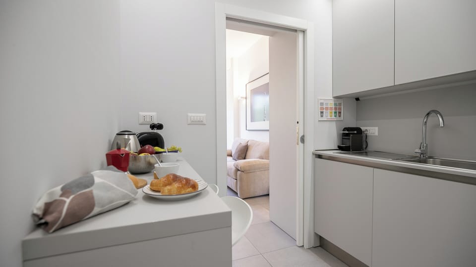 Apartment (2 Bedrooms) | Private kitchen | Espresso maker, microwave, electric kettle, highchair