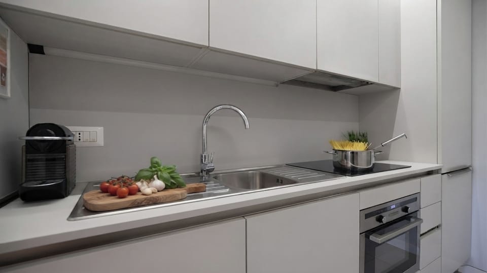 Apartment (2 Bedrooms) | Private kitchen | Espresso maker, microwave, electric kettle, highchair