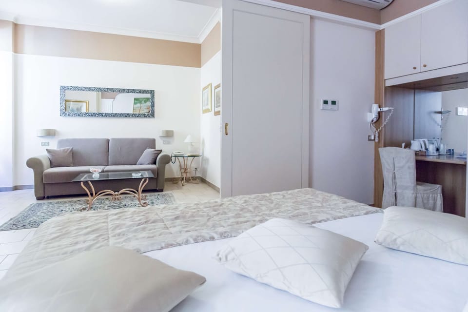 Family Room | Minibar, in-room safe, desk, iron/ironing board