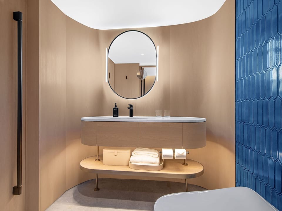 Shower, rainfall showerhead, designer toiletries, hair dryer