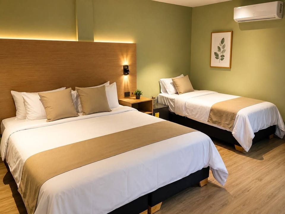 Standard Triple Room, Courtyard View | Down comforters, Select Comfort beds, minibar