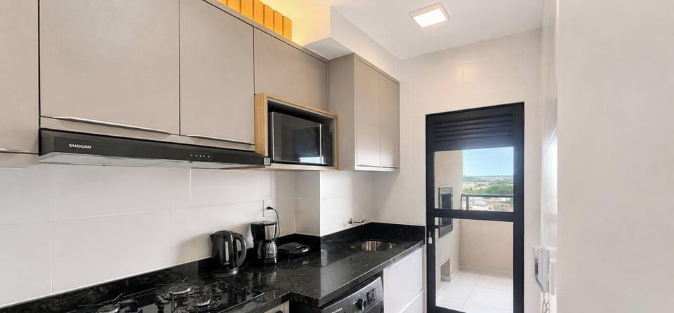 Premium Apartment, 2 Bedrooms, Pool Access | Private kitchen | Fridge, oven, cookware/dishes/utensils, kitchen island