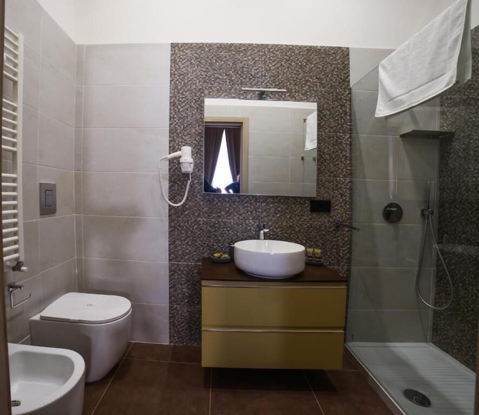 Deluxe Triple Room, Balcony, City View | Bathroom | Shower, rainfall showerhead, free toiletries, hair dryer