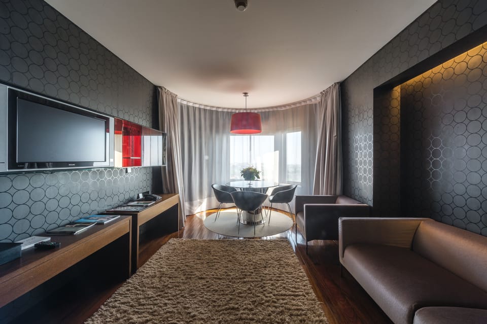 Superior Suite, River View | Living room | 45-inch LCD TV with cable channels, TV