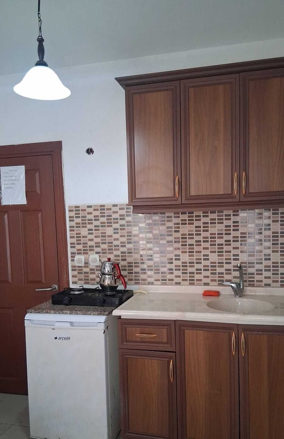 Mini-fridge, stovetop, cookware/dishes/utensils