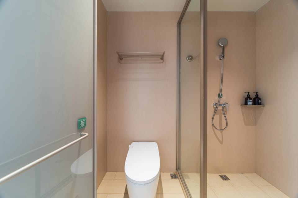 Shower, hair dryer, slippers, towels