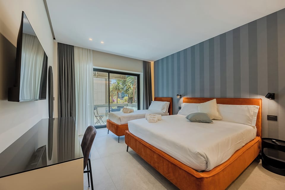 Luxury Triple Room, Balcony, Garden View | In-room safe, desk, laptop workspace, blackout drapes