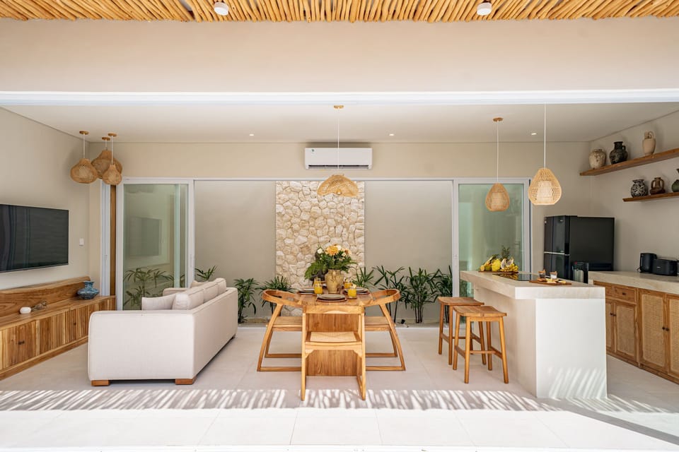 Deluxe Villa, 2 Bedrooms, Patio, Pool View | Living room | 55-inch TV with cable channels