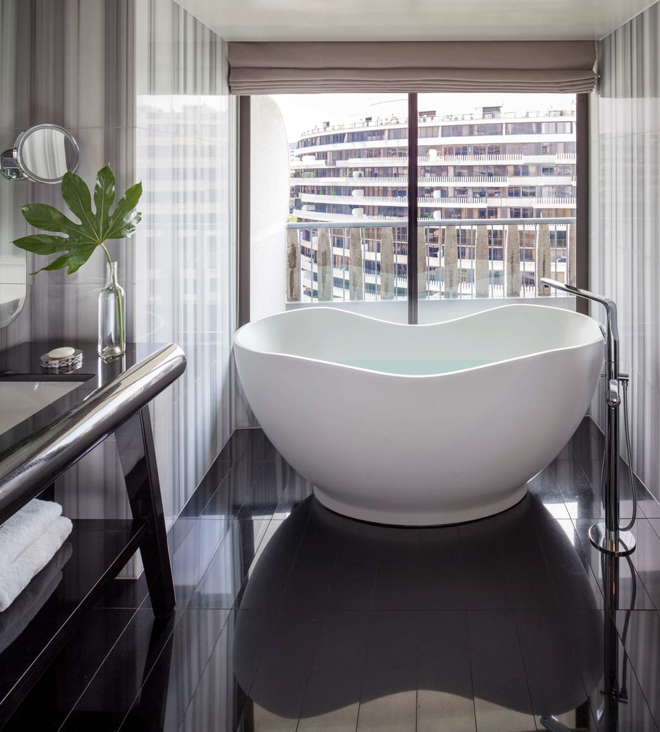 Designer toiletries, hair dryer, bathrobes, slippers