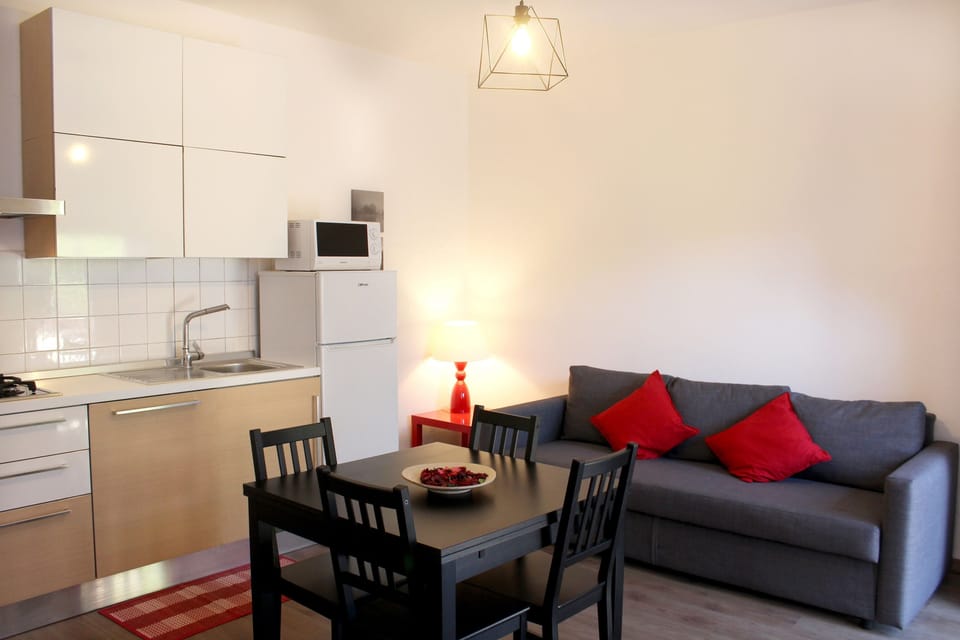 Family Apartment | Living area | 32-inch flat-screen TV with digital channels, TV