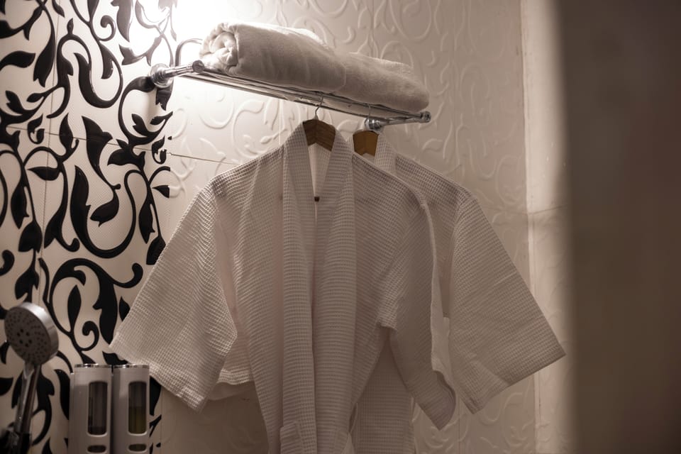 Luxury Double Room | Bathroom | Shower, slippers, towels, soap