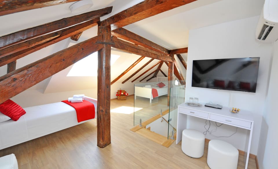 Deluxe Suite, Balcony, City View | Living area | LCD TV