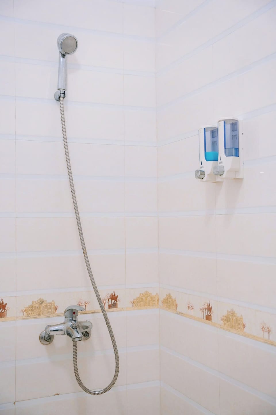 Shower, hair dryer, slippers, towels