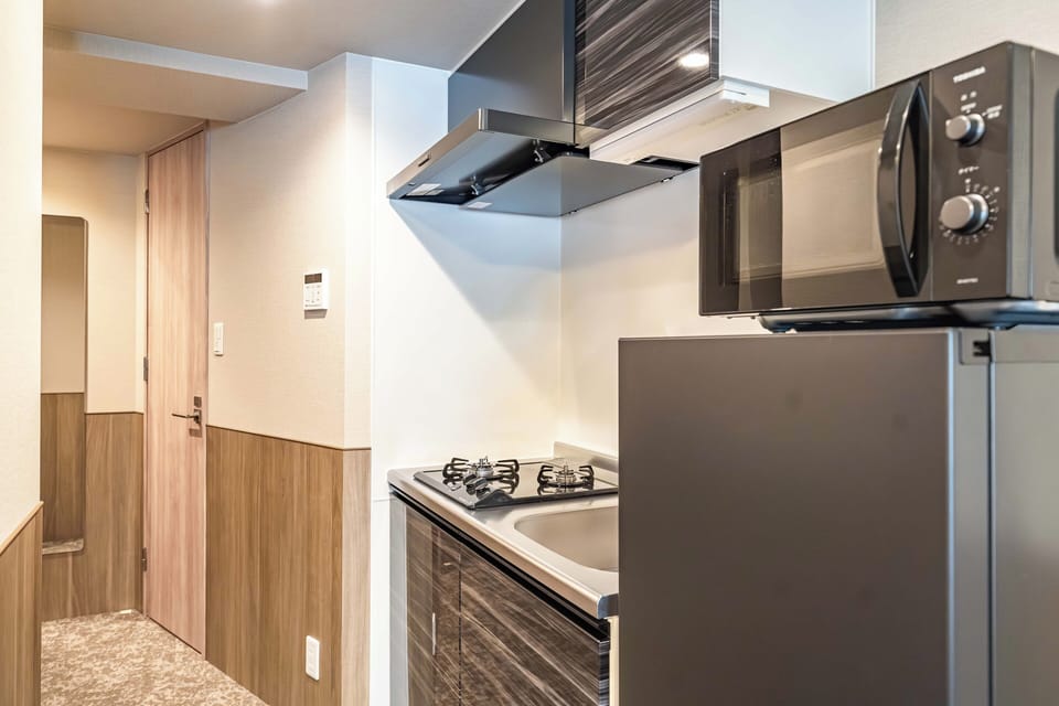 Standard Triple Room, Balcony, City View | Private kitchen | Fridge, microwave, stovetop, cookware/dishes/utensils
