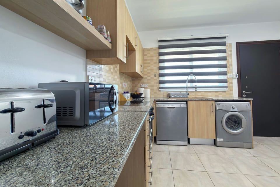 Apartment, Balcony, Pool View | Private kitchen
