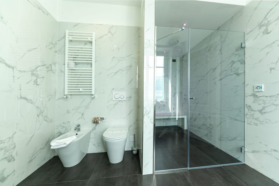 Junior Suite, Sauna | Bathroom | Shower, rainfall showerhead, free toiletries, hair dryer