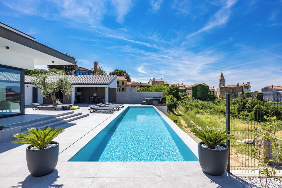 Outdoor pool, an infinity pool, open open 24 hours, pool umbrellas