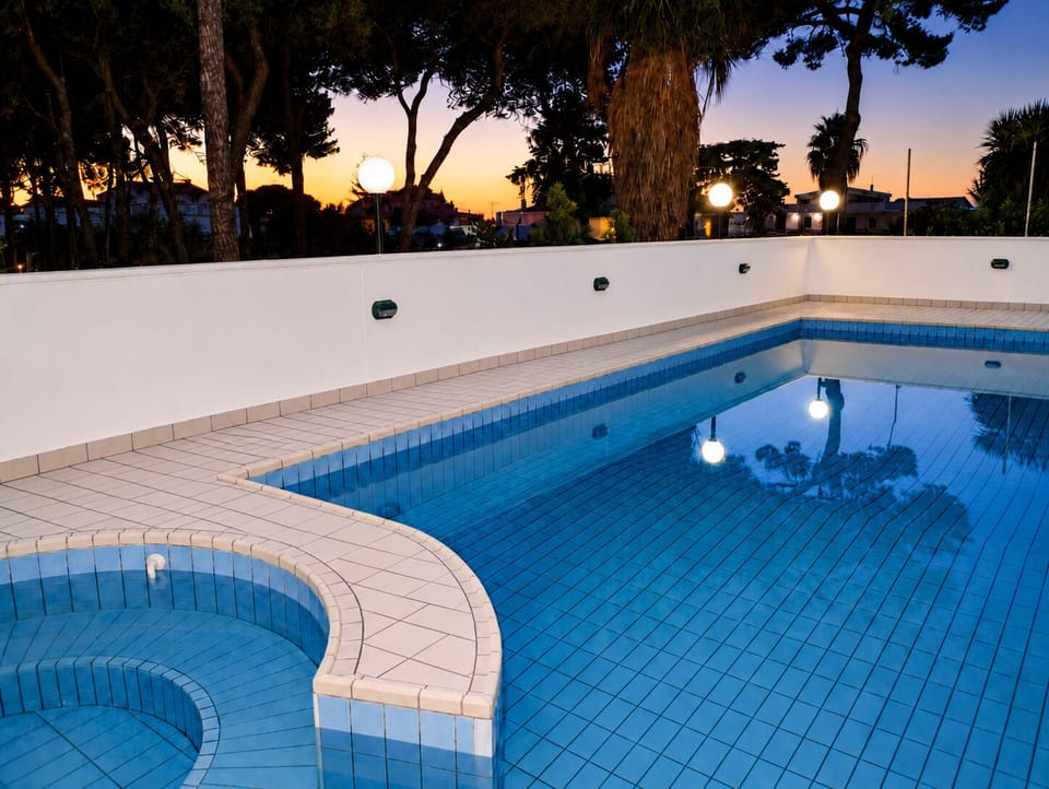 Seasonal outdoor pool, open 9:00 AM to 7:00 PM, pool umbrellas