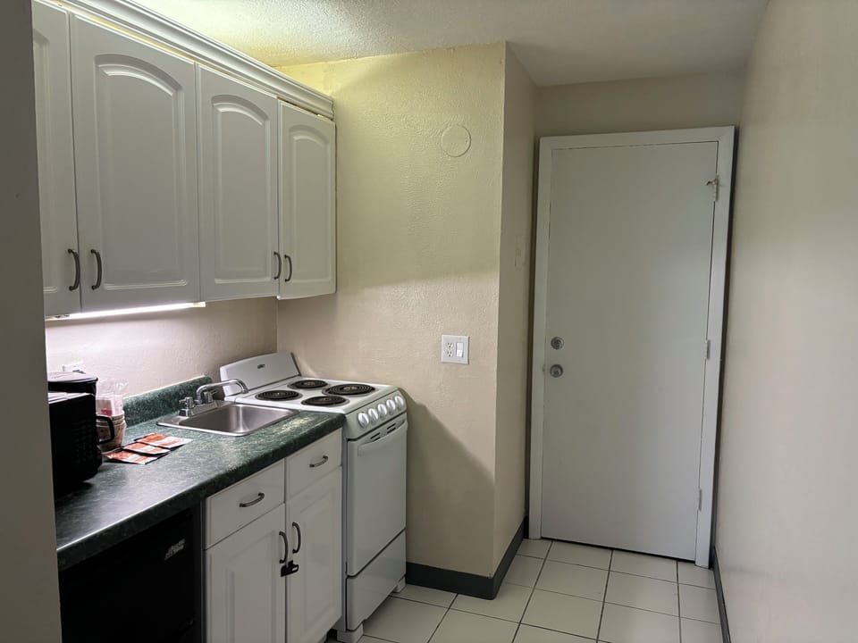 Deluxe Room, 2 Queen Beds, Kitchenette | Individually decorated, individually furnished, free WiFi, bed sheets