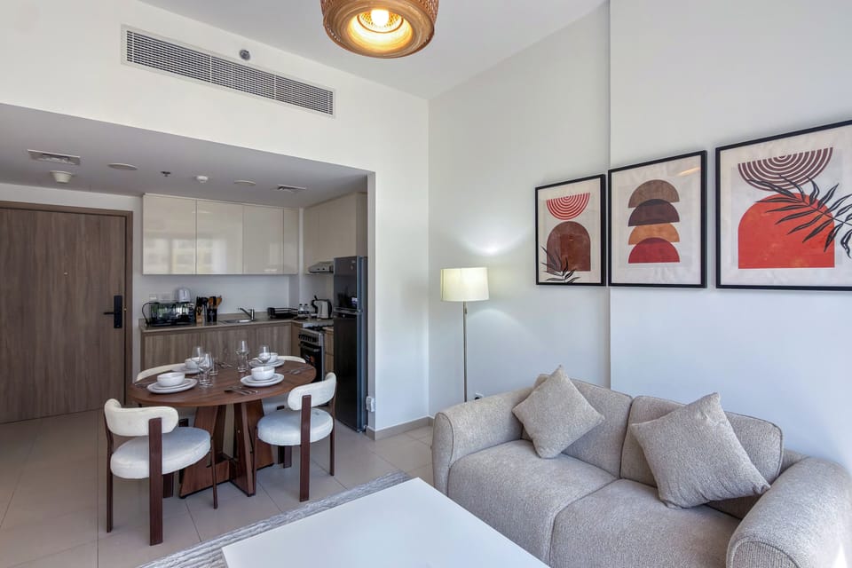 Deluxe Apartment, Balcony, Pool View | Living area | 55-inch Smart TV with digital channels