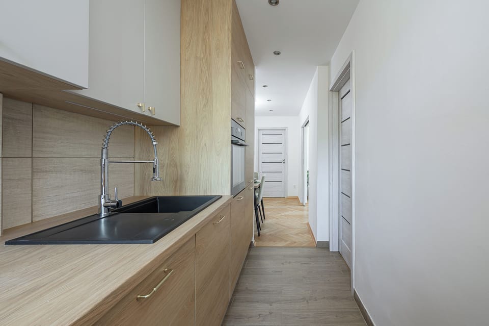 Classic Apartment, 2 Bedrooms, Courtyard View | Private kitchen | Electric kettle, highchair, griddle, eco-friendly cleaning products