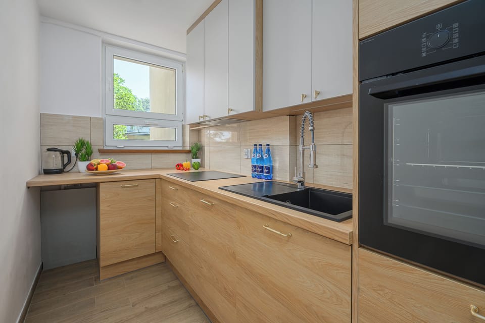 Classic Apartment, 2 Bedrooms, Courtyard View | Private kitchen | Electric kettle, highchair, griddle, eco-friendly cleaning products